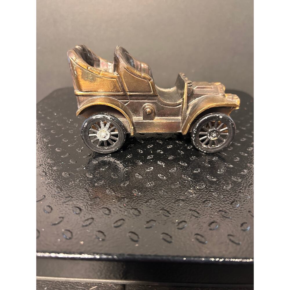 vintage Banthrico 1906 Oldsmobile coin bank made of diecast brass metal
